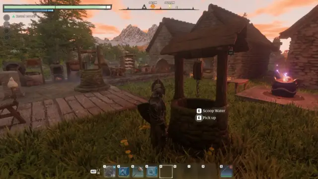 A player beside a stone well and another well at a base